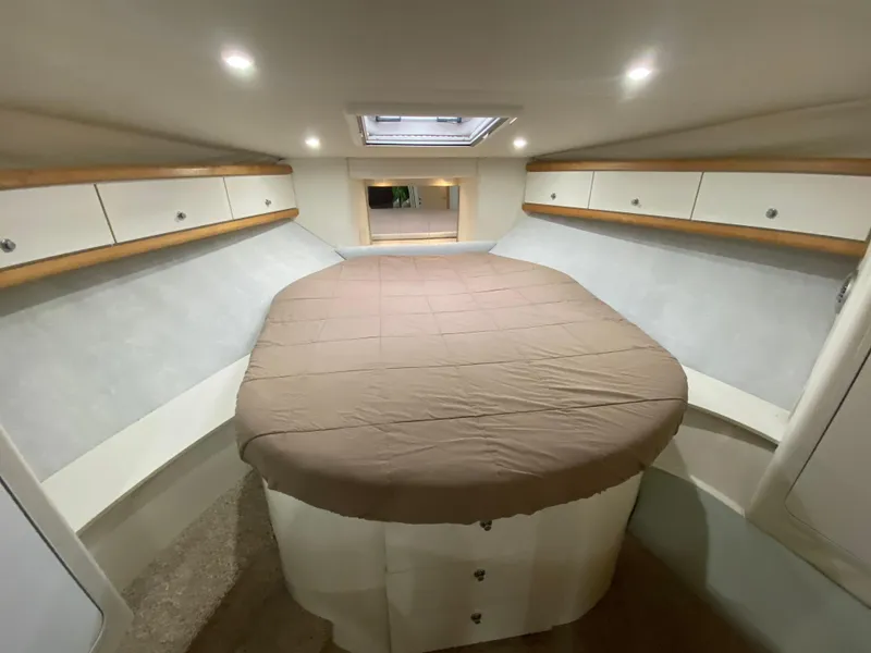 Slide: The Image of Interior cabin of 1996 Carver 390 Express with bed and storage cabinets. - 12