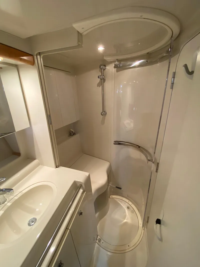 Slide: The Image of Bathroom interior of 1996 Carver 390 Express yacht, featuring shower and sink. - 17