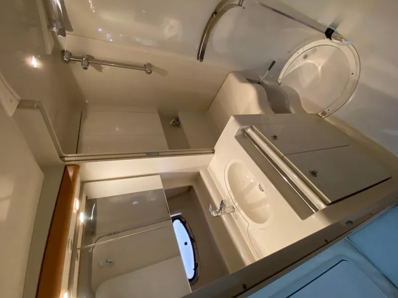 Slide: The Image of Bathroom interior of 1996 Carver 390 Express yacht, featuring sink and shower. - 18