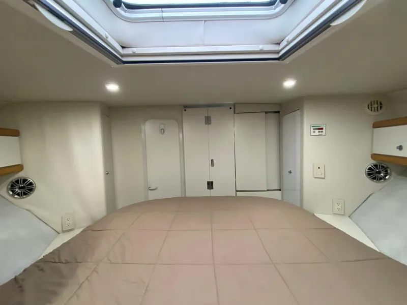 Slide: The Image of Interior cabin of 1996 Carver 390 Express with skylight and cozy bed. - 24