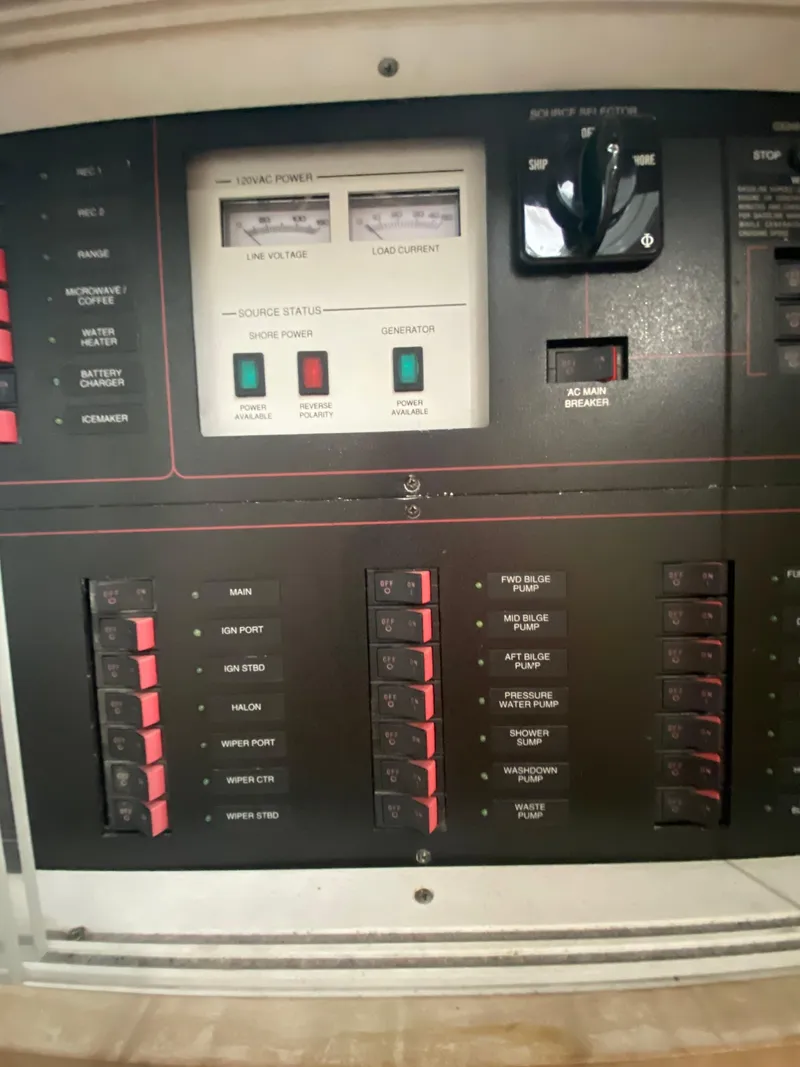 Slide: The Image of Control panel of a 1996 Carver 390 Express boat, featuring switches and indicators. - 30
