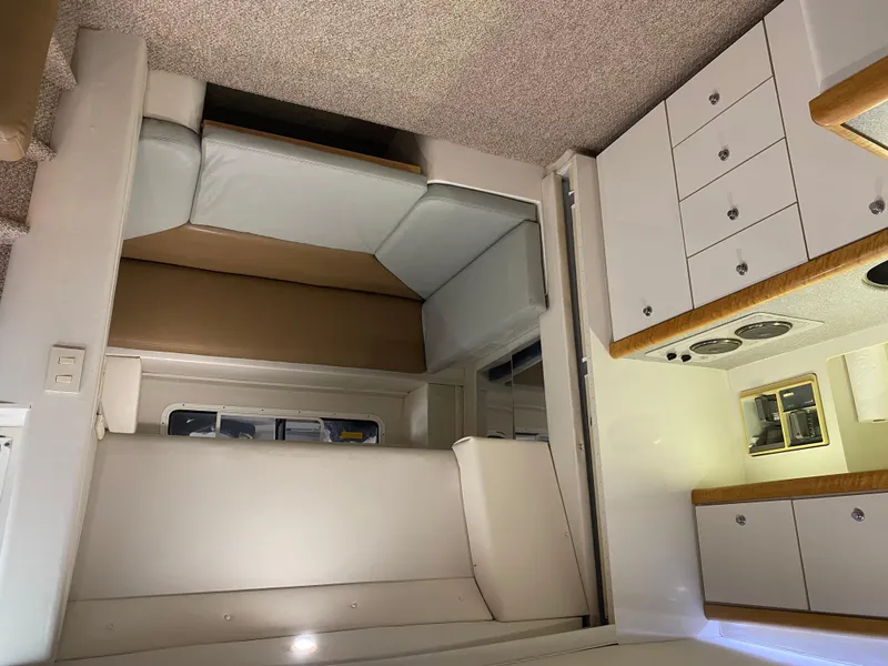 Slide: The Image of Interior of 1996 Carver 390 Express yacht with seating and cabinetry. - 34