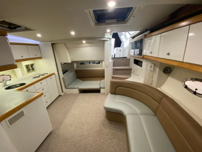 Slide: The Image of Interior of 1996 Carver 390 Express yacht with modern kitchen and seating area. - 38