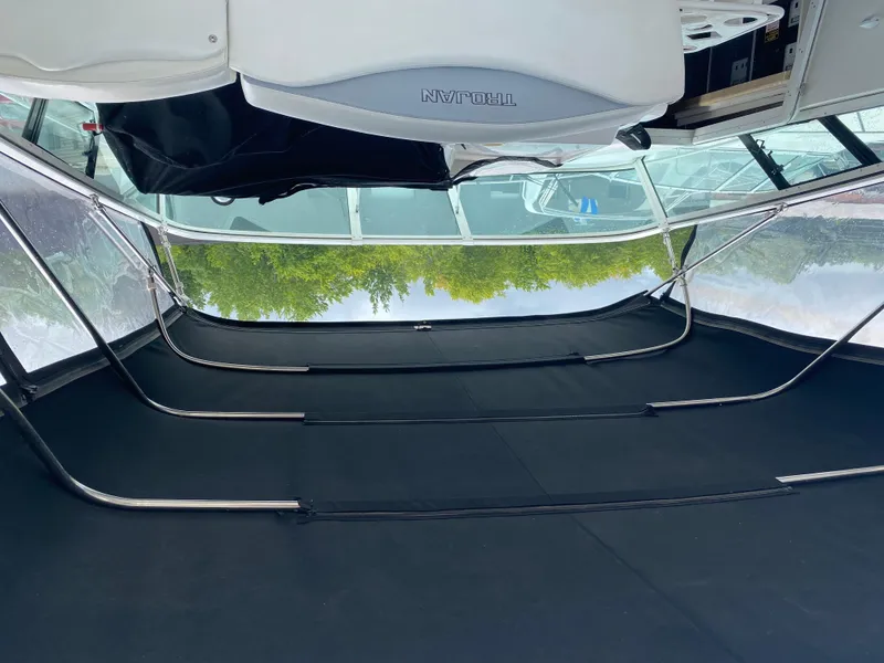 Slide: The Image of 1996 Carver 390 Express boat interior with canopy and seating area. - 4