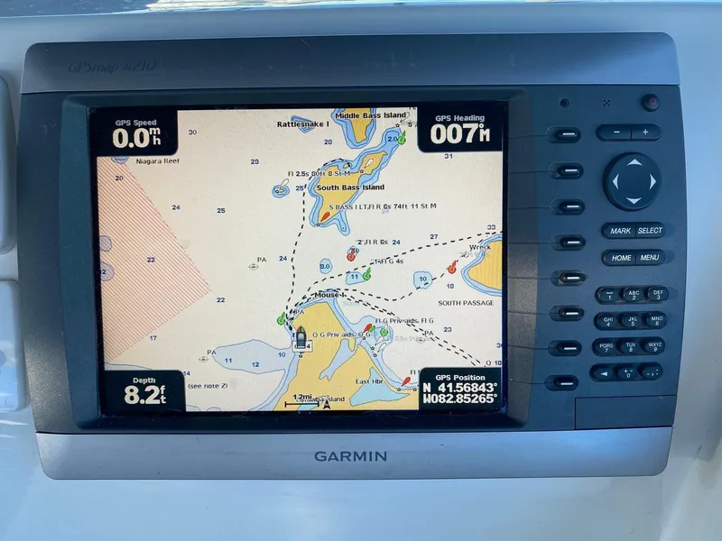 Slide: The Image of Garmin GPS display on 1996 Carver 390 Express, showing nautical map and navigation data. - 9