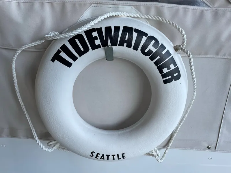 Slide: The Image of Life preserver labeled "Tidewatcher Seattle" on 1961 Chris-Craft Conqueror boat. - 2