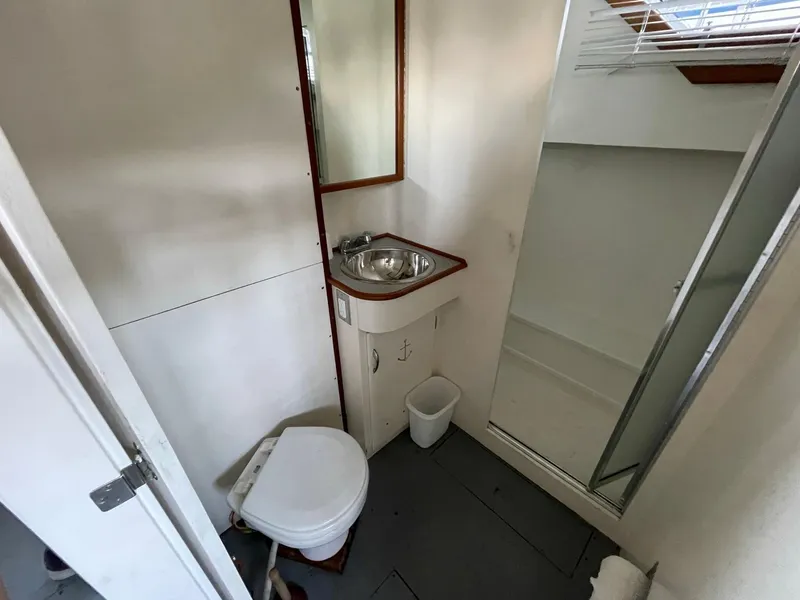 Slide: The Image of 1961 Chris-Craft Conqueror bathroom with sink, toilet, and shower. - 28