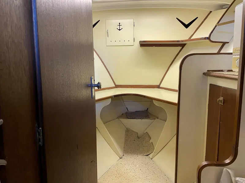 Slide: The Image of 1961 Chris-Craft Conqueror cabin interior with wooden accents and nautical decor. - 30