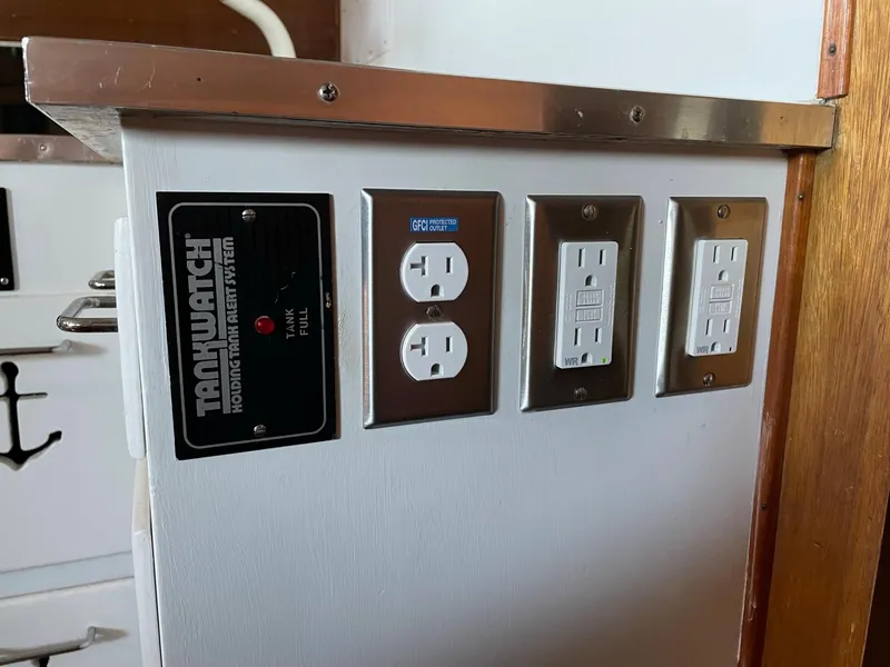 Slide: The Image of 1961 Chris-Craft Conqueror interior showing electrical outlets and panel. - 32