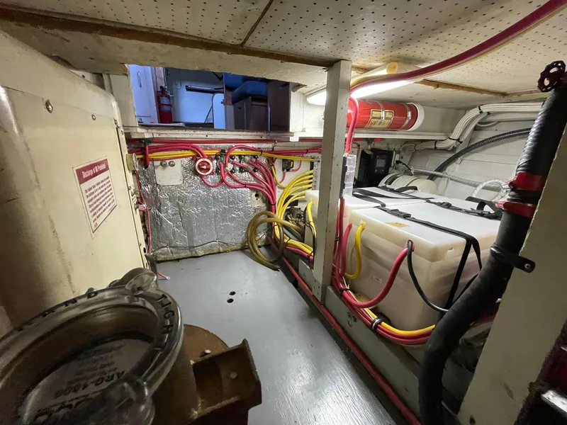 Slide: The Image of Engine room of a 1961 Chris-Craft Conqueror with wiring and equipment. - 45