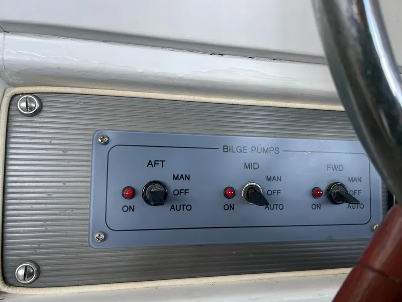 Slide: The Image of 1961 Chris-Craft Conqueror bilge pump control panel with manual and automatic settings. - 9
