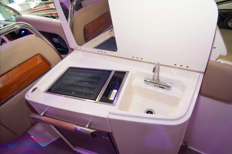 Slide: The Image of 2024 Chris-Craft Launch 35 GT boat interior with sink and grill station. - 33