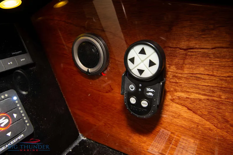 Slide: The Image of Control panel of 2024 Chris-Craft Launch 35 GT with wooden finish and speaker. - 46