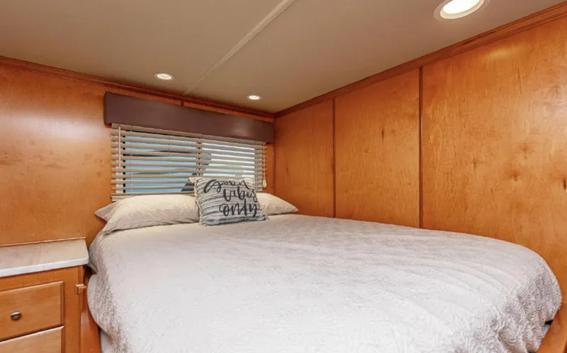 Slide: The Image of Cozy bedroom in 2007 Horizon 18 x 80 houseboat with wooden walls and comfortable bedding. - 14