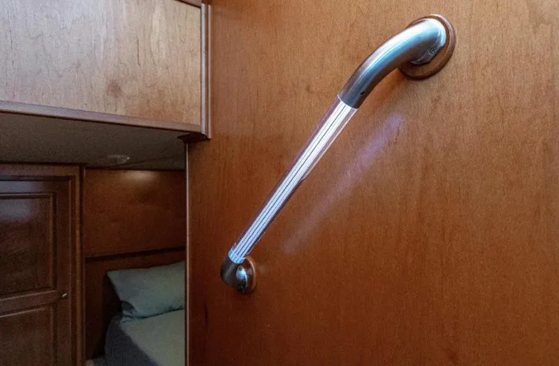 Slide: The Image of Wooden interior of 2007 Horizon 18 x 80 houseboat with metal handrail. - 18