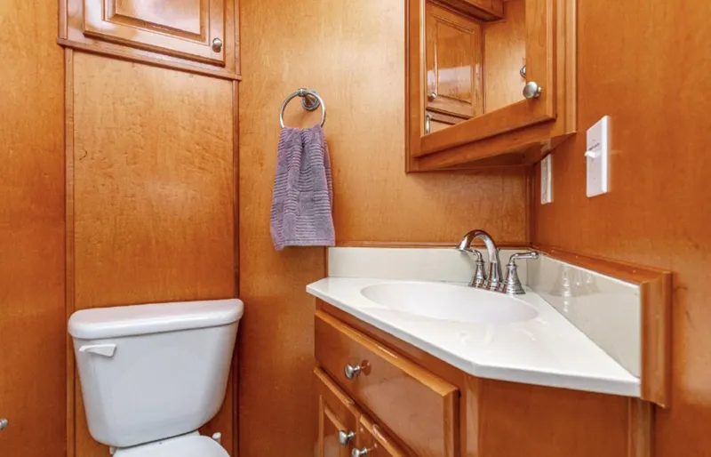 Slide: The Image of Compact wooden bathroom in a 2007 Horizon 18 x 80 houseboat. - 23
