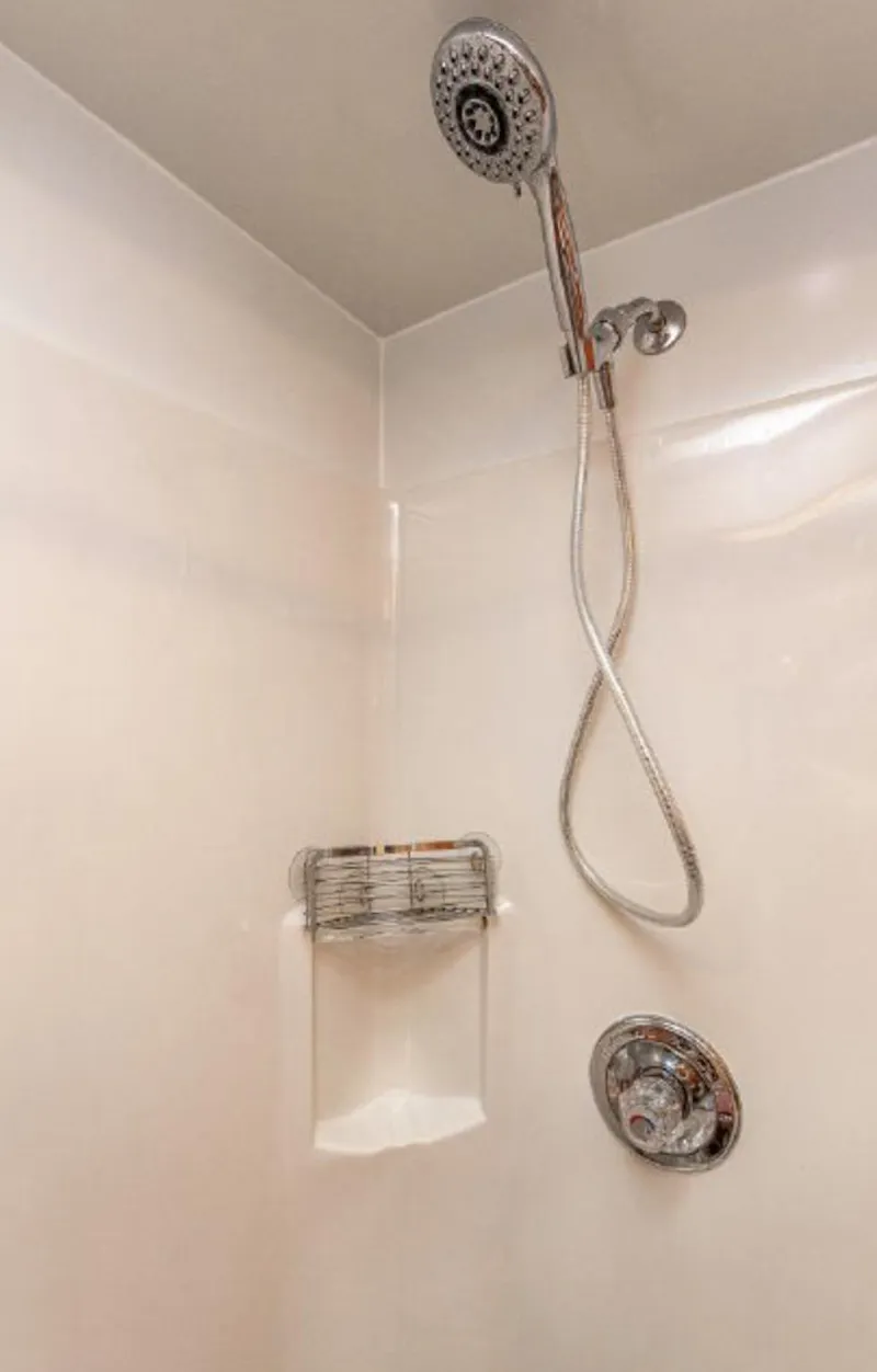 Slide: The Image of Shower area in 2007 Horizon 18 x 80 houseboat with chrome fixtures. - 24
