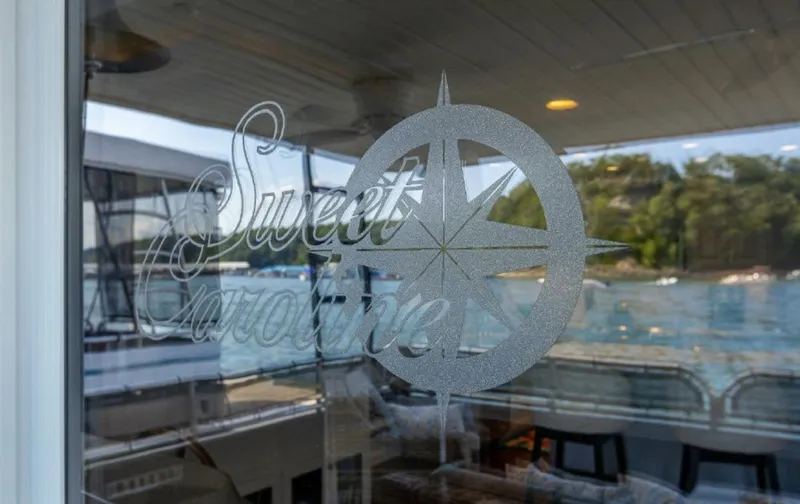 Slide: The Image of Sweet Caroline etched on glass of 2007 Horizon 18 x 80 houseboat. - 28