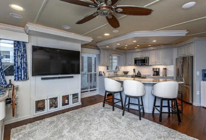 Slide: The Image of Luxurious interior of 2007 Horizon 18 x 80 houseboat with modern kitchen and living area. - 3