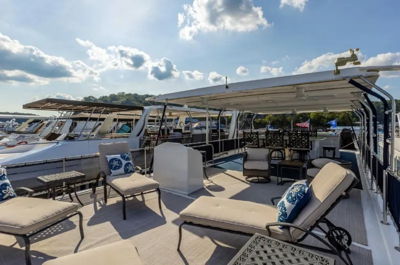 Slide: The Image of 2007 Horizon 18 x 80 houseboat with spacious deck and lounge chairs. - 31