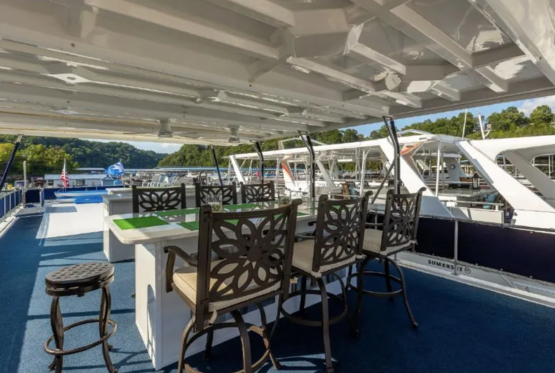 Slide: The Image of Upper deck of 2007 Horizon 18 x 80 houseboat with bar seating and scenic marina view. - 33