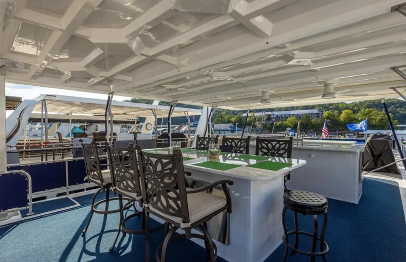 Slide: The Image of Spacious deck of 2007 Horizon 18 x 80 houseboat with outdoor seating and bar area. - 34