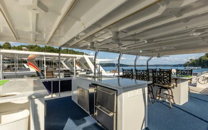 Slide: The Image of Upper deck of 2007 Horizon 18 x 80 houseboat with outdoor kitchen and seating area. - 35