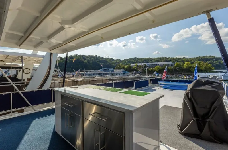 Slide: The Image of Outdoor deck of 2007 Horizon 18 x 80 houseboat with stainless steel counter and scenic marina view. - 37