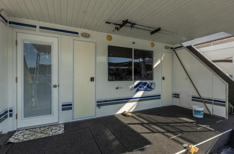Slide: The Image of 2007 Horizon 18 x 80 houseboat rear deck with stairs and glass door. - 39