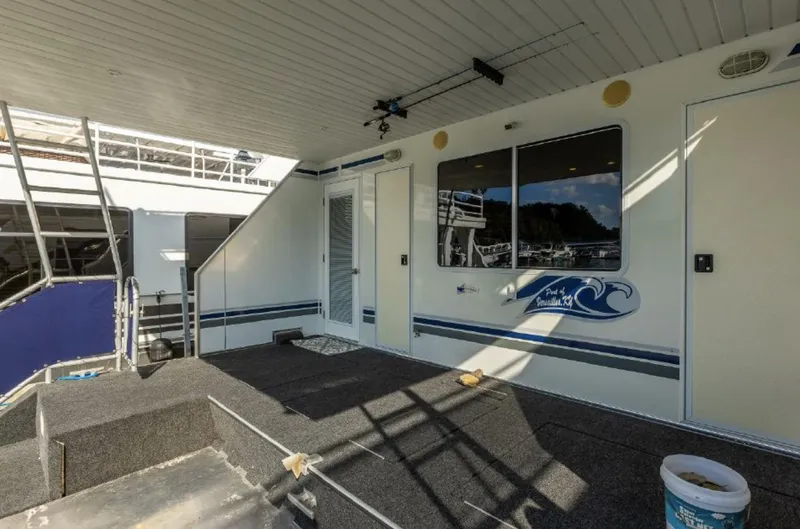 Slide: The Image of 2007 Horizon 18 x 80 houseboat deck with stairs and exterior view. - 40