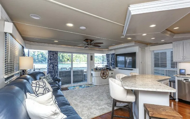 Slide: The Image of Luxurious interior of a 2007 Horizon 18 x 80 houseboat with modern furnishings and lake view. - 9