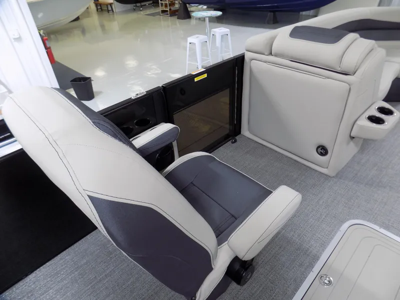 Slide: The Image of 2024 Barletta C22UC boat interior with gray and black seating. - 10