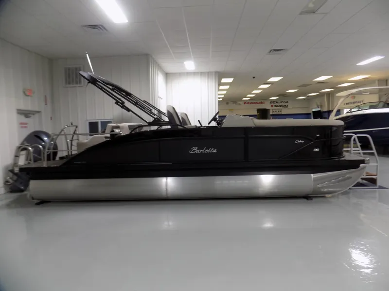 Slide: The Image of 2024 Barletta C22UC pontoon boat in showroom. - 4