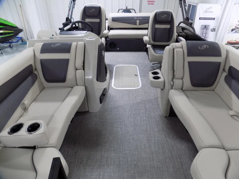 Slide: The Image of 2024 Barletta C22UC pontoon boat interior with luxurious seating and modern design. - 6