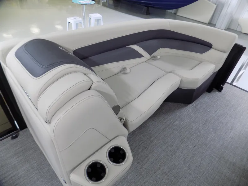 Slide: The Image of 2024 Barletta C22UC boat interior with luxurious seating and cup holders. - 7