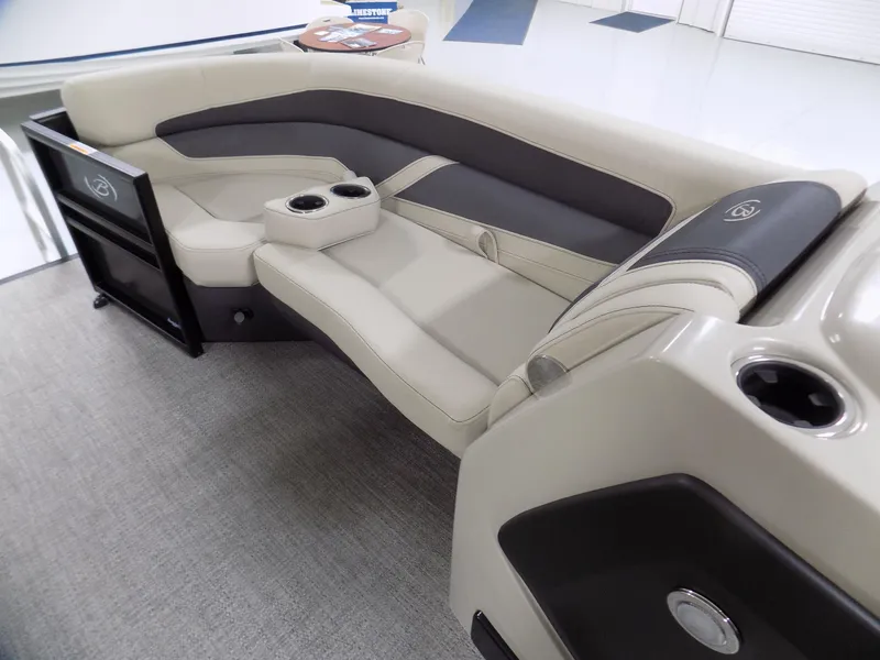Slide: The Image of 2024 Barletta C22UC boat interior with luxurious seating and cup holders. - 8