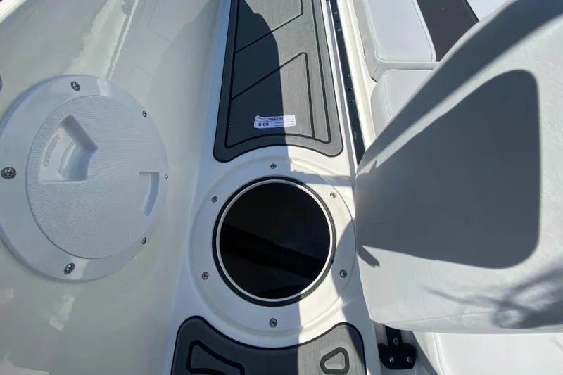 Slide: The Image of 2024 Bayliner Element M19 boat interior with storage compartment and seating. - 17