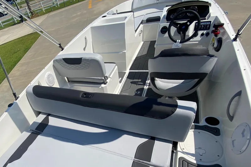 Slide: The Image of 2024 Bayliner Element M19 boat interior with seating and steering console. - 18