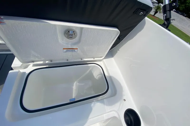 Slide: The Image of 2024 Bayliner Element M19 boat storage compartment with open lid. - 21