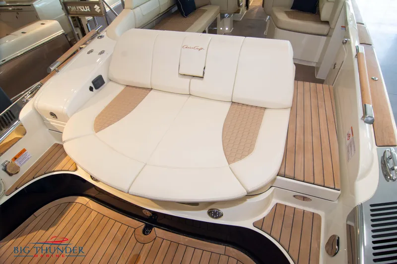 Slide: The Image of 2023 Chris-Craft Launch 31 GT boat interior with luxurious seating and teak flooring. - 12