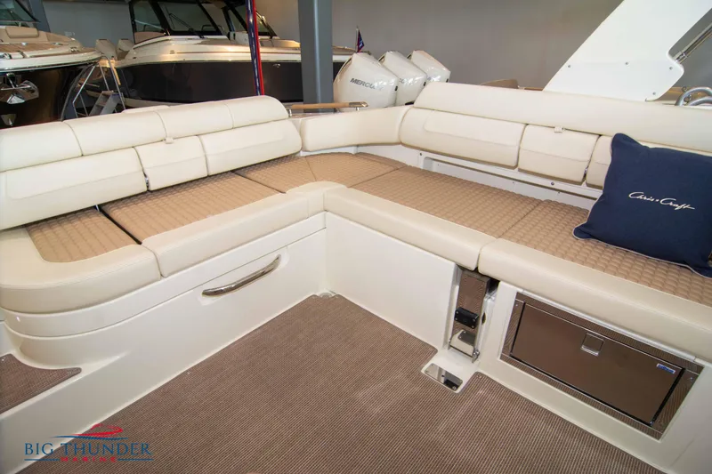 Slide: The Image of 2023 Chris-Craft Launch 31 GT boat interior with beige seating and storage compartments. - 22