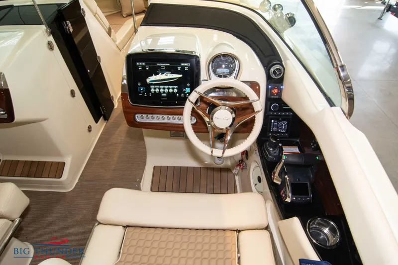 Slide: The Image of 2023 Chris-Craft Launch 31 GT cockpit with modern navigation system and luxurious interior. - 32