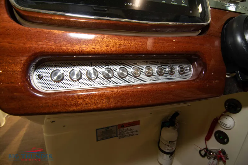 Slide: The Image of Control panel of 2023 Chris-Craft Launch 31 GT boat with wooden finish. - 37