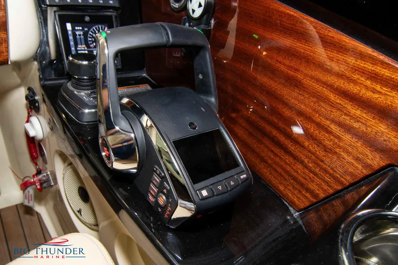 Slide: The Image of Chris-Craft Launch 31 GT 2023 boat control panel with throttle and navigation display. - 41