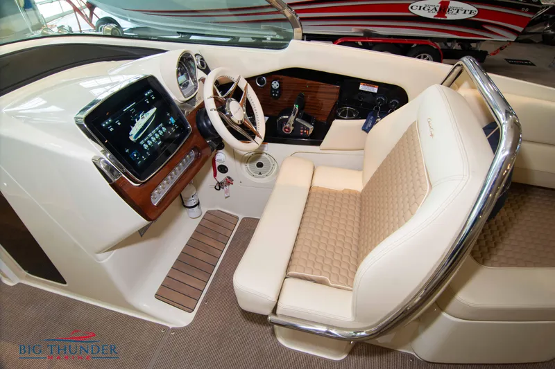 Slide: The Image of 2023 Chris-Craft Launch 31 GT cockpit with luxurious seating and advanced controls. - 46