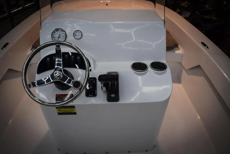 Slide: The Image of 2023 Savannah SS19 boat console with steering wheel and controls. - 10