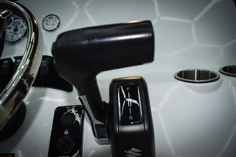 Slide: The Image of Close-up of 2023 Savannah SS19 boat throttle control and dashboard. - 18