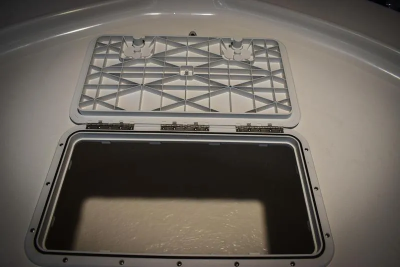 Slide: The Image of Open storage compartment on a 2023 Savannah SS19 boat. - 25