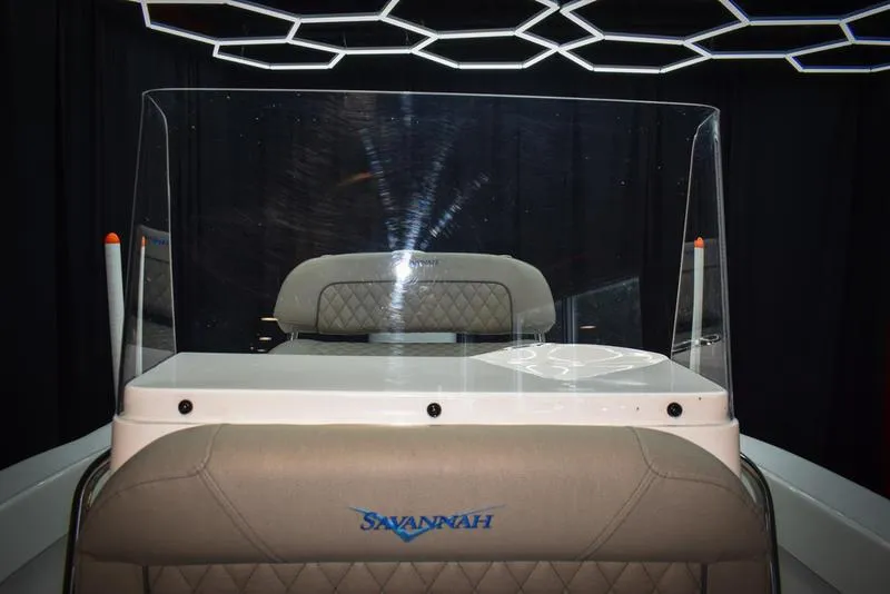 Slide: The Image of 2023 Savannah SS19 boat interior with windshield and seating. - 26
