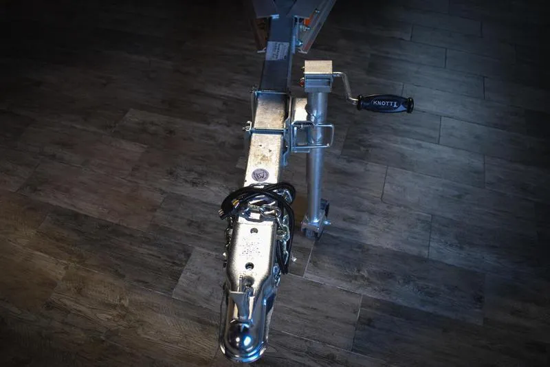 Slide: The Image of Close-up of a 2023 Savannah SS19 trailer hitch on wooden floor. - 27